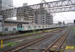 Serie 203 (JR)/ Tokyo Metro Chiyoda-Linie: Ausfahrt des 10-Wagenzugs mit ostseitigem Steuerwagen KUHA 203-105 aus Abiko, 11.Juli 2010.