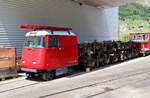 Draisine und ein Vorrat an Drehgestellen der Dampfbahn Furka-Bergstrecke beim Depot in Realp.